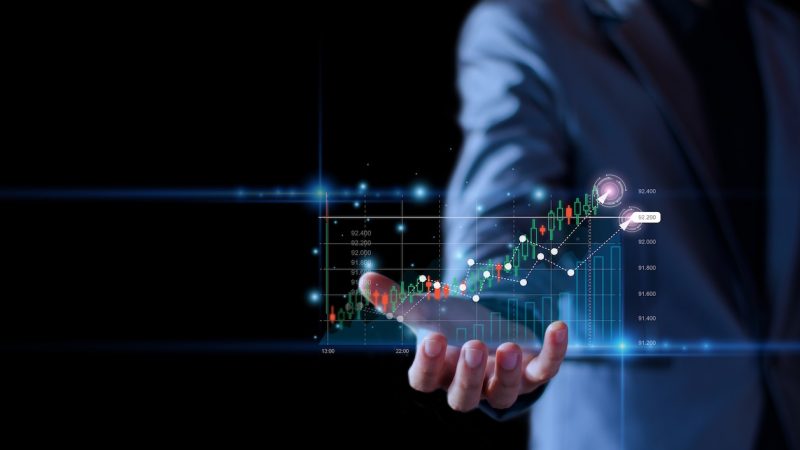 Business growing Concept. Businessman holding show stock chart up. profit from business, marketing strategy, investment planning, online digital business success, analyze economic trends. stock graph.